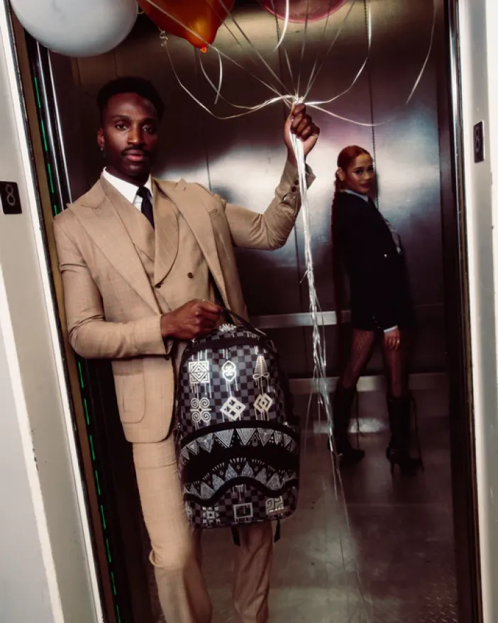 AFRICAN INTELLIGENCE 9 POWER GLYPHICS BACKPACK - SANDFLOWER COLLAB>SPRAYGROUND Sale