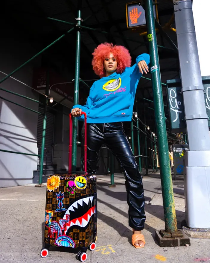 GLOBAL MOGUL POPAGANDA RON ENGLISH EDITION HARDSHELL CARRY-ON LUGGAGE>SPRAYGROUND New